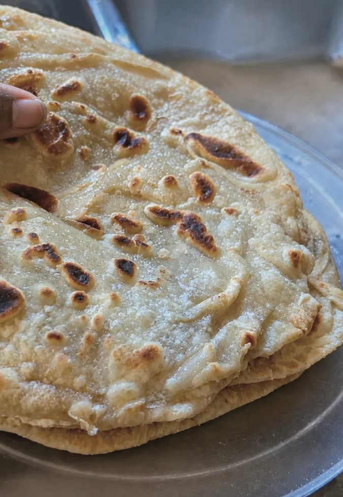 A stack of golden, layered East African chapati